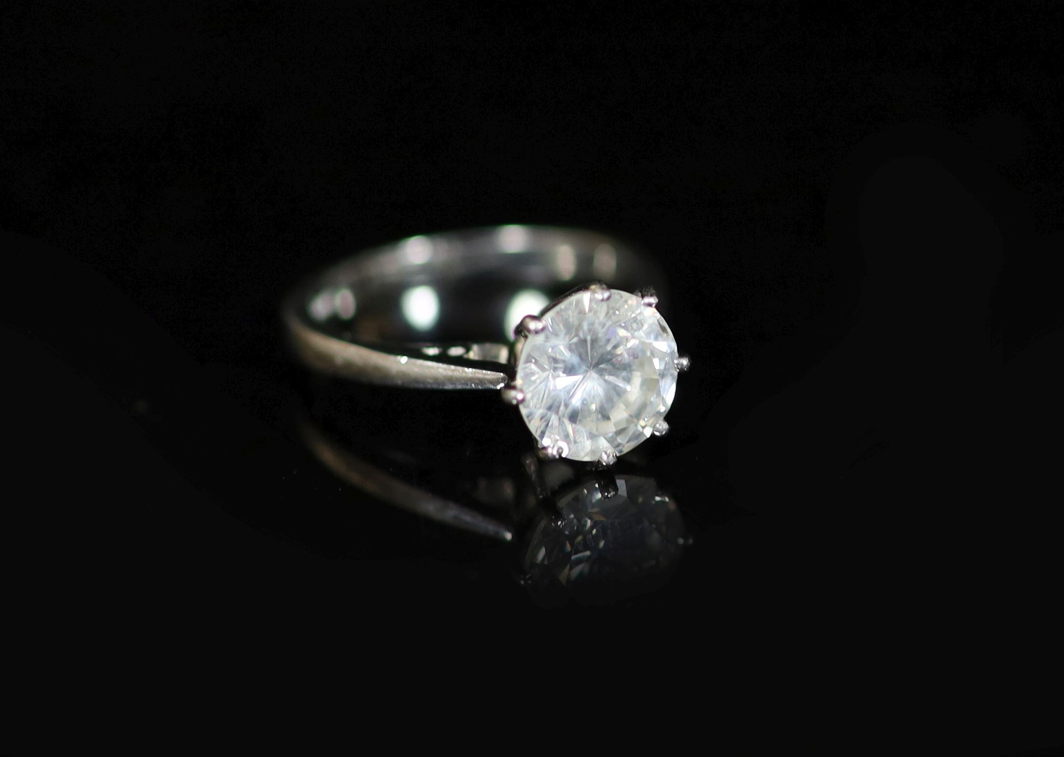 A modern platinum and solitaire diamond ring